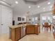 Spacious kitchen with granite countertops, stainless steel appliances, and an island with seating at 8333 Via Verona, Orlando, FL 32836