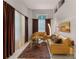 Bright living room showcasing stylish furnishings, a decorative rug, and elegant curtains framing the windows for a cozy atmosphere at 8333 Via Verona, Orlando, FL 32836
