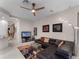 Inviting living room featuring a comfortable leather sectional, modern decor, and an open layout at 8333 Via Verona, Orlando, FL 32836