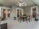 Covered patio with outdoor seating and direct access to the backyard, ideal for relaxation and entertaining at 8333 Via Verona, Orlando, FL 32836