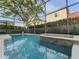 Swimming pool and hot tub, enclosed within a screened lanai, offer a private retreat at 8333 Via Verona, Orlando, FL 32836