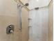 Modern shower featuring sleek fixtures, elegant tilework, and built-in shelving for convenience at 8333 Via Verona, Orlando, FL 32836