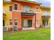 Townhome exterior showcasing a balcony and patio area, perfect for outdoor relaxation at 8502 Crystal Cove Loop, Kissimmee, FL 34747