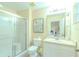 Clean bathroom with a glass-enclosed shower, white vanity, and neutral walls at 8502 Crystal Cove Loop, Kissimmee, FL 34747