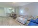 Bright, open-concept living room with modern decor, wood-style floors, dining area, and comfortable seating at 8502 Crystal Cove Loop, Kissimmee, FL 34747