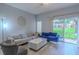 Comfortable living room with stylish furnishings, a modern marble coffee table, and sliding doors to a balcony at 8502 Crystal Cove Loop, Kissimmee, FL 34747
