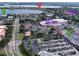 Aerial view of a shopping center with nearby residential areas and access to main roads and waterfront views at 8515 Saint Marino Blvd, Orlando, FL 32836