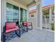 Cozy balcony with seating, ideal for enjoying outdoor living with a view of the architecture at 8515 Saint Marino Blvd, Orlando, FL 32836