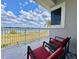 Inviting balcony featuring comfortable seating and stunning lake views, perfect for enjoying the scenery at 8515 Saint Marino Blvd, Orlando, FL 32836