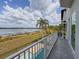 Scenic balcony view overlooking a lake and pool area, perfect for relaxing and enjoying the outdoors at 8515 Saint Marino Blvd, Orlando, FL 32836