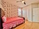 Bedroom featuring modern decor, closet and ceiling fan, plus an ensuite bath at 8515 Saint Marino Blvd, Orlando, FL 32836