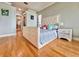 Bright bedroom with hardwood floors, a plush bed, and stylish decor, offering a cozy retreat at 8515 Saint Marino Blvd, Orlando, FL 32836