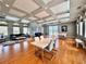 Spacious common room with hardwood floors, modern lighting, and access to a balcony with scenic views at 8515 Saint Marino Blvd, Orlando, FL 32836