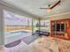 Bright exercise room with views of pool, water, and backyard; features infrared sauna at 8515 Saint Marino Blvd, Orlando, FL 32836
