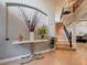 Bright and airy foyer featuring a staircase and decorative accents at 8515 Saint Marino Blvd, Orlando, FL 32836