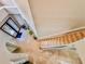 Overhead view of the foyer featuring a staircase and decorative accents at 8515 Saint Marino Blvd, Orlando, FL 32836