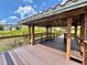 Charming gazebo featuring built-in benches, perfect for relaxing by the water and enjoying the scenic views at 8515 Saint Marino Blvd, Orlando, FL 32836