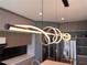 Unique modern pendant lighting above a kitchen island, illuminating sleek countertops at 8515 Saint Marino Blvd, Orlando, FL 32836