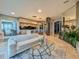 Open living space featuring a sleek sofa, modern kitchen and a dining area at 8515 Saint Marino Blvd, Orlando, FL 32836