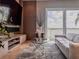 Modern living room featuring a stylish sofa and glass table with scenic outdoor views at 8515 Saint Marino Blvd, Orlando, FL 32836