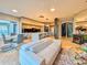 Bright living area with contemporary furniture, seamlessly connected to a modern kitchen at 8515 Saint Marino Blvd, Orlando, FL 32836
