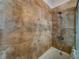 Elegant shower featuring large neutral colored tiles and updated fixtures at 8515 Saint Marino Blvd, Orlando, FL 32836