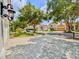 Neighborhood street view featuring mature trees and well-maintained homes with red tile roofs at 8515 Saint Marino Blvd, Orlando, FL 32836