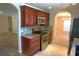 Kitchen with granite countertops, stainless steel appliances, and ample cabinet storage at 8613 Edge O Woods Ct, Orlando, FL 32819