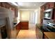 Kitchen featuring granite counters, stainless appliances, and elegant cabinetry at 8613 Edge O Woods Ct, Orlando, FL 32819