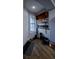 Cozy entryway featuring a wooden shelf, a white door, and a charming 'Welcome to Florida' sign at 9208 Chandler Dr, Groveland, FL 34736