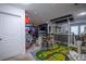 Amusing entertainment area featuring a mural, a mini-bar, barstools, and a colorful roadway rug at 9208 Chandler Dr, Groveland, FL 34736