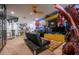 Spacious entertainment space showcasing a mini-bar, a large dragon statue, superhero artwork, and comic book rug at 9208 Chandler Dr, Groveland, FL 34736