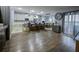 Spacious kitchen with island seating, stainless appliances, and adjacent bar area, great for entertaining at 9208 Chandler Dr, Groveland, FL 34736