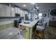 Bright kitchen featuring a large island, stainless appliances, ample cabinetry, and recessed lighting at 9208 Chandler Dr, Groveland, FL 34736