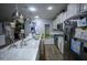 Bright kitchen featuring a large island, stainless appliances, ample cabinetry, and recessed lighting at 9208 Chandler Dr, Groveland, FL 34736