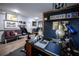 Home office featuring a desk, a chalkboard wall with writing, and a comfortable seating area at 9208 Chandler Dr, Groveland, FL 34736