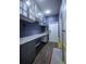Custom office space featuring built-in cabinets and a long workspace at 9208 Chandler Dr, Groveland, FL 34736