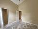 Bedroom with closet access and neutral paint; needs flooring at 928 Chanler Dr, Haines City, FL 33844
