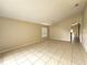 Bright living room featuring tiled flooring, neutral wall colors, and ample natural light at 928 Chanler Dr, Haines City, FL 33844