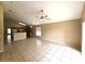 Open living room showcasing neutral walls, ceiling fan, and tile flooring at 928 Chanler Dr, Haines City, FL 33844