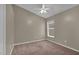 Carpeted bedroom with ceiling fan and window at 9871 Nonacrest Dr, Orlando, FL 32832