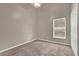 Carpeted bedroom featuring a ceiling fan and window at 9871 Nonacrest Dr, Orlando, FL 32832
