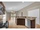 Open kitchen featuring stainless steel appliances and a breakfast bar, perfect for entertaining at 9871 Nonacrest Dr, Orlando, FL 32832
