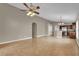 Spacious living area featuring tile floors, neutral walls, and an open floor plan at 9871 Nonacrest Dr, Orlando, FL 32832