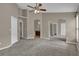 Spacious main bedroom featuring plush carpet, ample closet space, and ensuite bathroom at 9871 Nonacrest Dr, Orlando, FL 32832