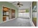 Screened patio with ceiling fan and access to the interior through sliding glass doors at 9871 Nonacrest Dr, Orlando, FL 32832