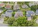 The property has mature trees, manicured lawns, and a screened-in pool at 10030 Chatham Oaks Ct, Orlando, FL 32836