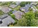 An aerial view of a neighborhood with many homes, mature trees, and manicured lawns at 10030 Chatham Oaks Ct, Orlando, FL 32836