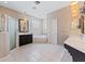 Bright bathroom with dual sinks, walk-in shower, and soaking tub at 10030 Chatham Oaks Ct, Orlando, FL 32836