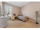 Bedroom features a twin bed, a white dresser, neutral walls, and a window at 10030 Chatham Oaks Ct, Orlando, FL 32836